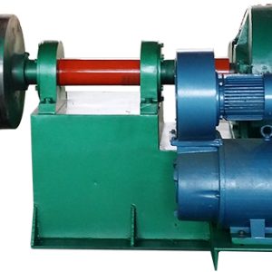 Angled slider coil strapping machine